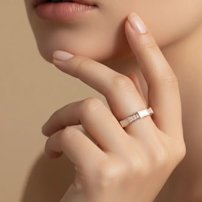 Close-up of a hand wearing a ring with a soft focus background